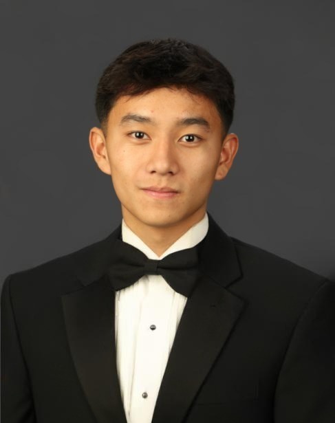Professional portrait of Vince in a tuxedo