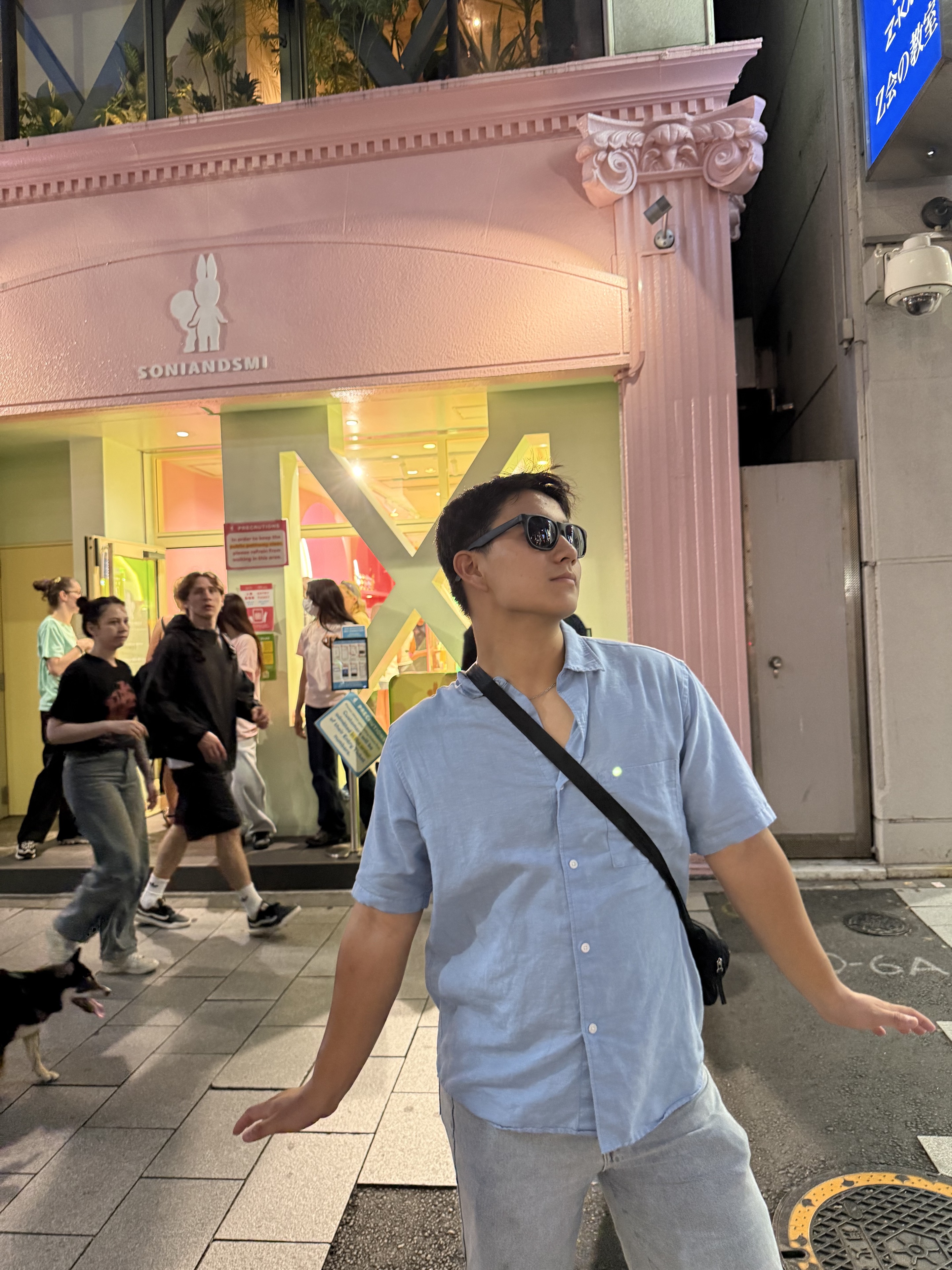 Vince exploring a colorful city street at night